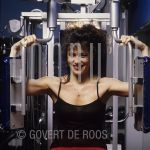 Leonie Sazias (Date Unknown) on location.

[keywords]Posed, Half Length, Eyecontact, Smiling, Gym[/keywords]